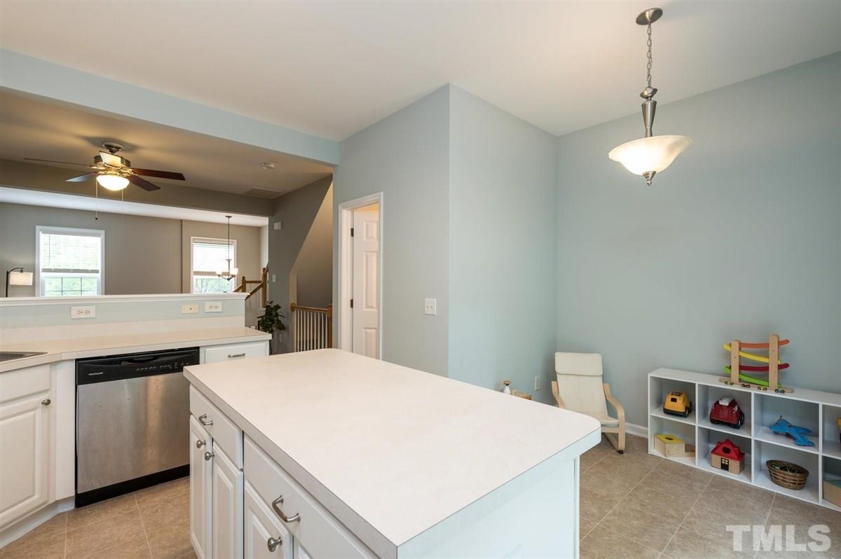 5414 Echo Ridge Road Raleigh, NC 27612 - Photo 10 of 22 a kitchen with a stove cabinets and wooden floor