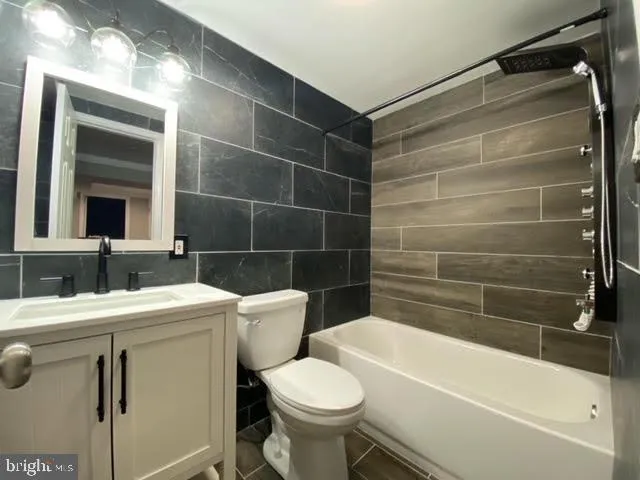 a bathroom with a sink a toilet and a bathtub