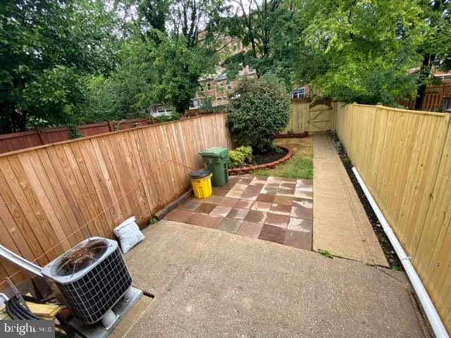 a view of a backyard with sitting area