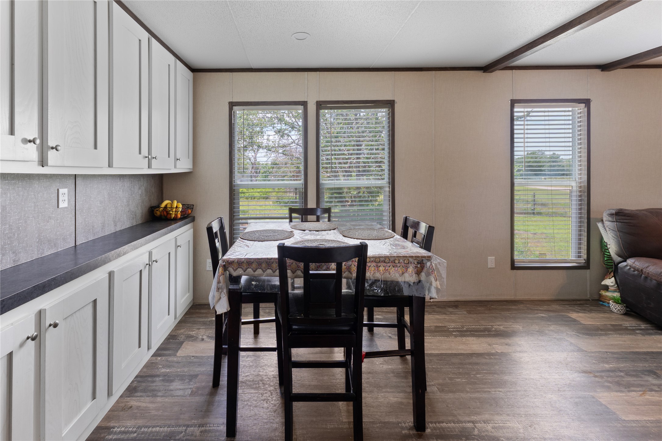 109 Hibiscus Cove Elgin, TX 78621 - Photo 6 of 15 A charming dining area features ample counter space and scenic outdoor views.