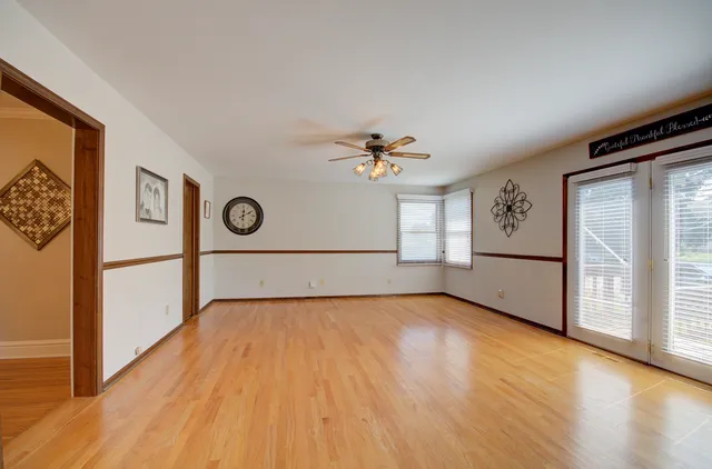 a view of kitchen with wooden floor and electronic appliances