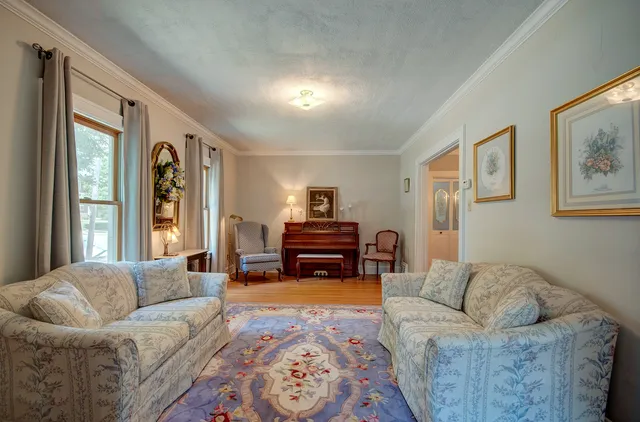 a dining room with furniture and chandelier