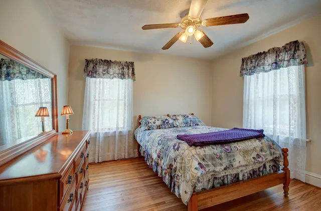 a view of livingroom with furniture window and wooden floor
