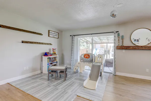 a view of a dining room with furniture window and wooden floor