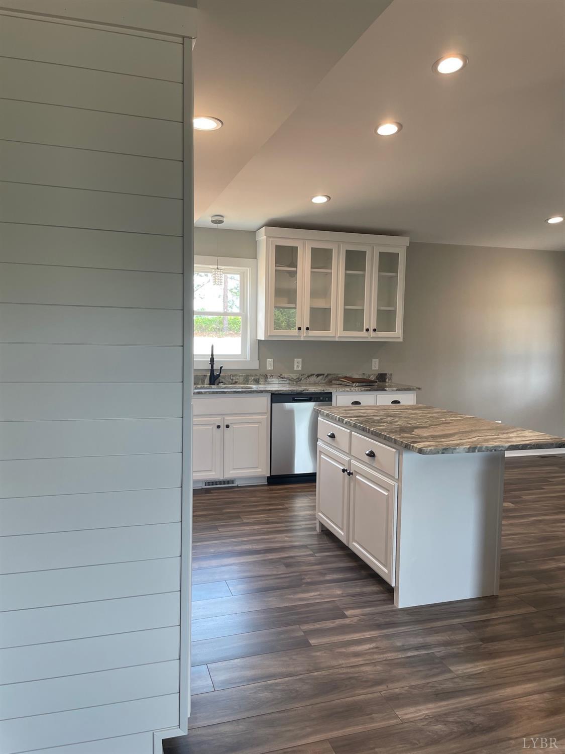 819 Winfall Road Rustburg, VA 24554 - Photo 6 of 15 a large kitchen with granite countertop a stove and a sink