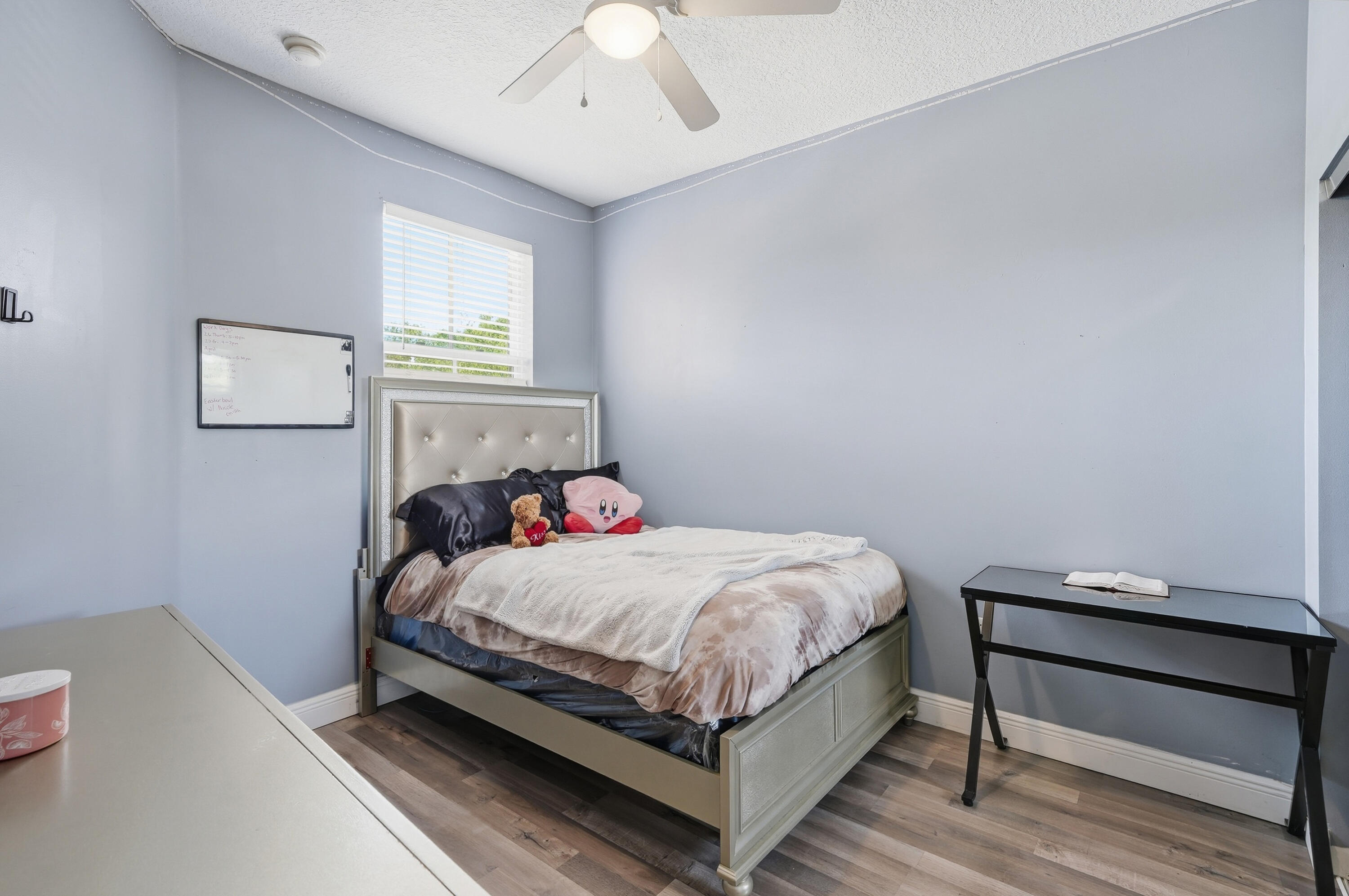 5825 Siena Lane Hollywood, FL 33021 - Photo 15 of 26 a bedroom with a bed and a window