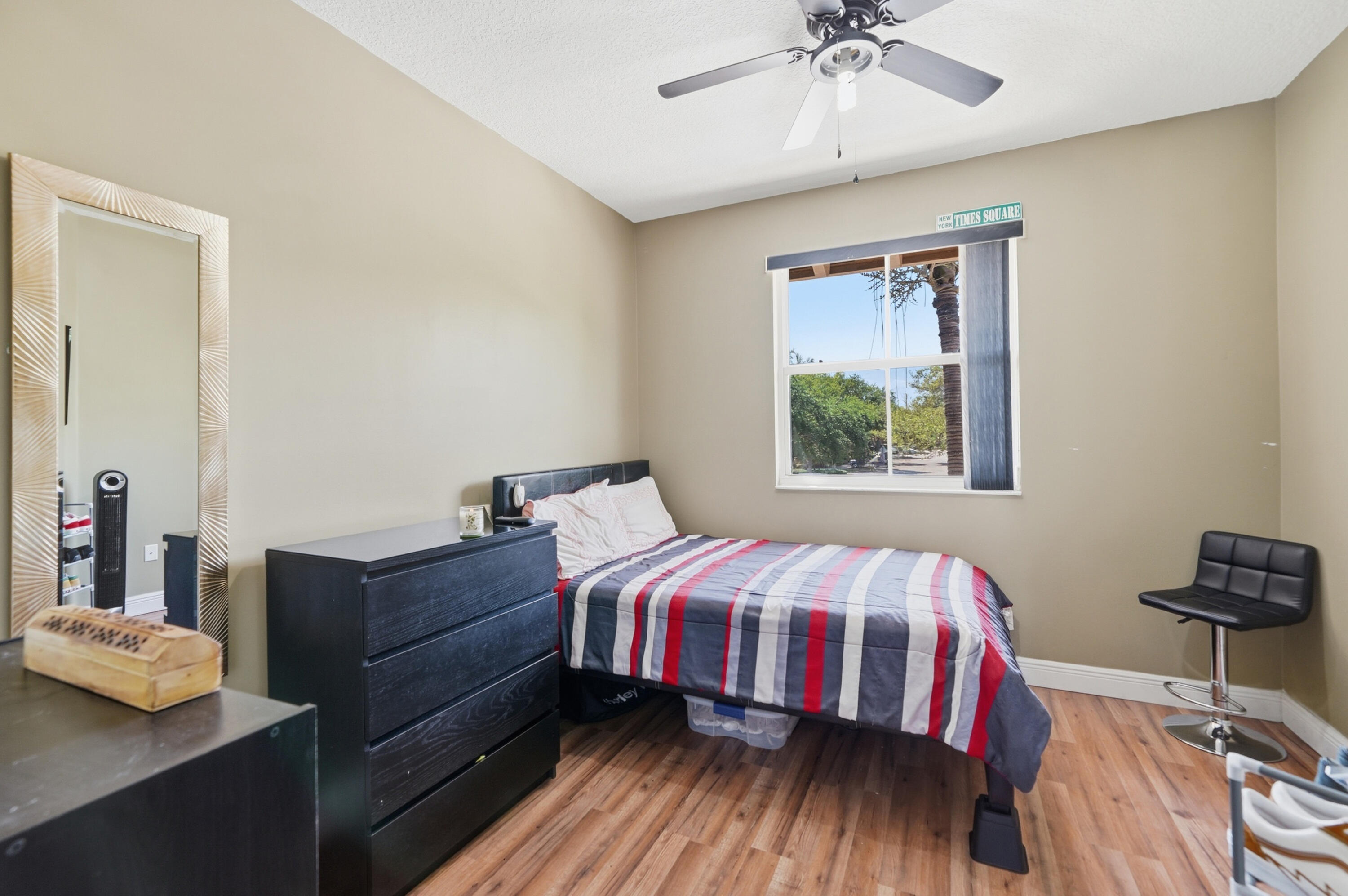 5825 Siena Lane Hollywood, FL 33021 - Photo 16 of 26 a bedroom with a bed and a chandelier