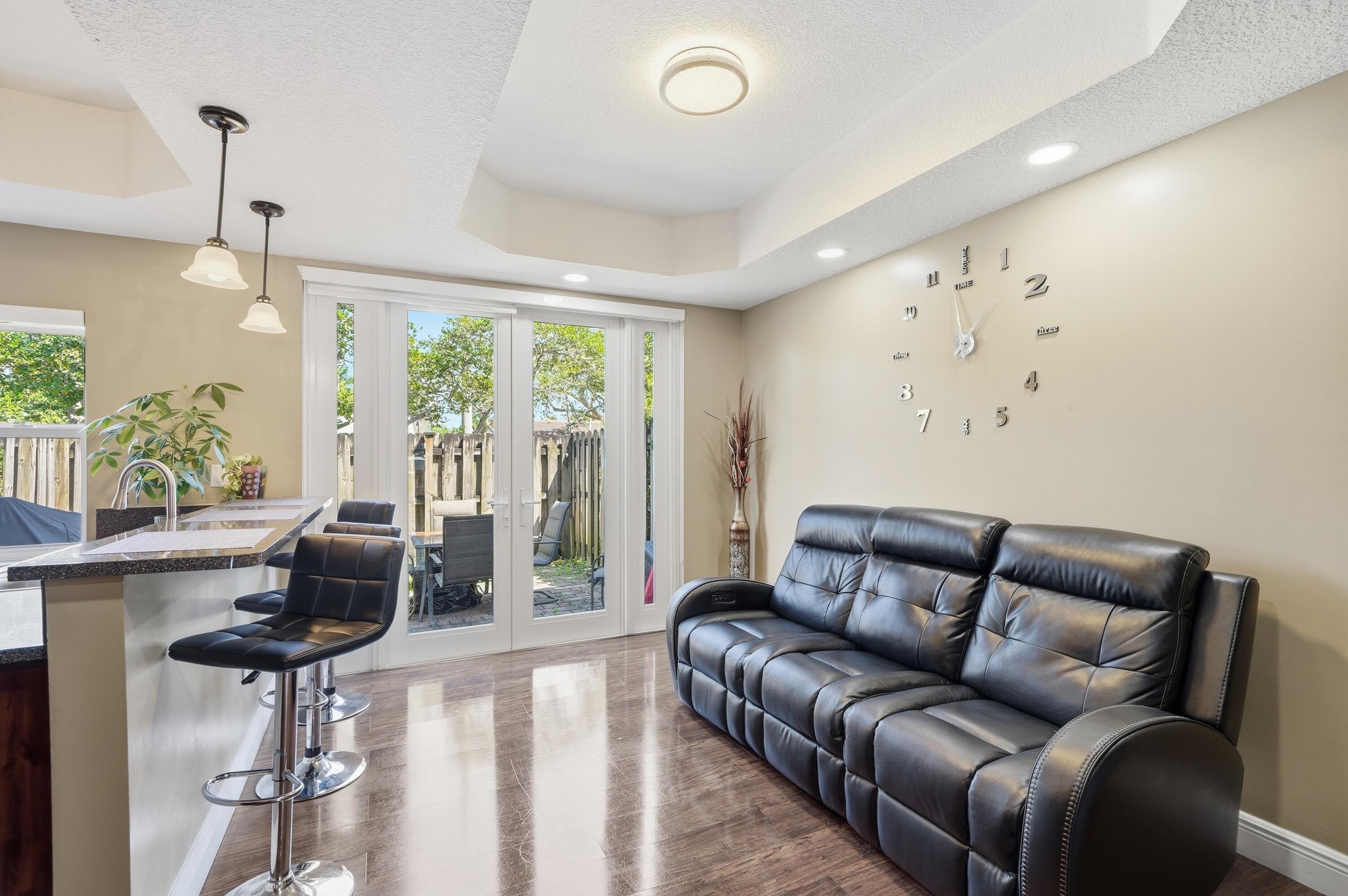 5825 Siena Lane Hollywood, FL 33021 - Photo 6 of 26 a living room with furniture and a large window