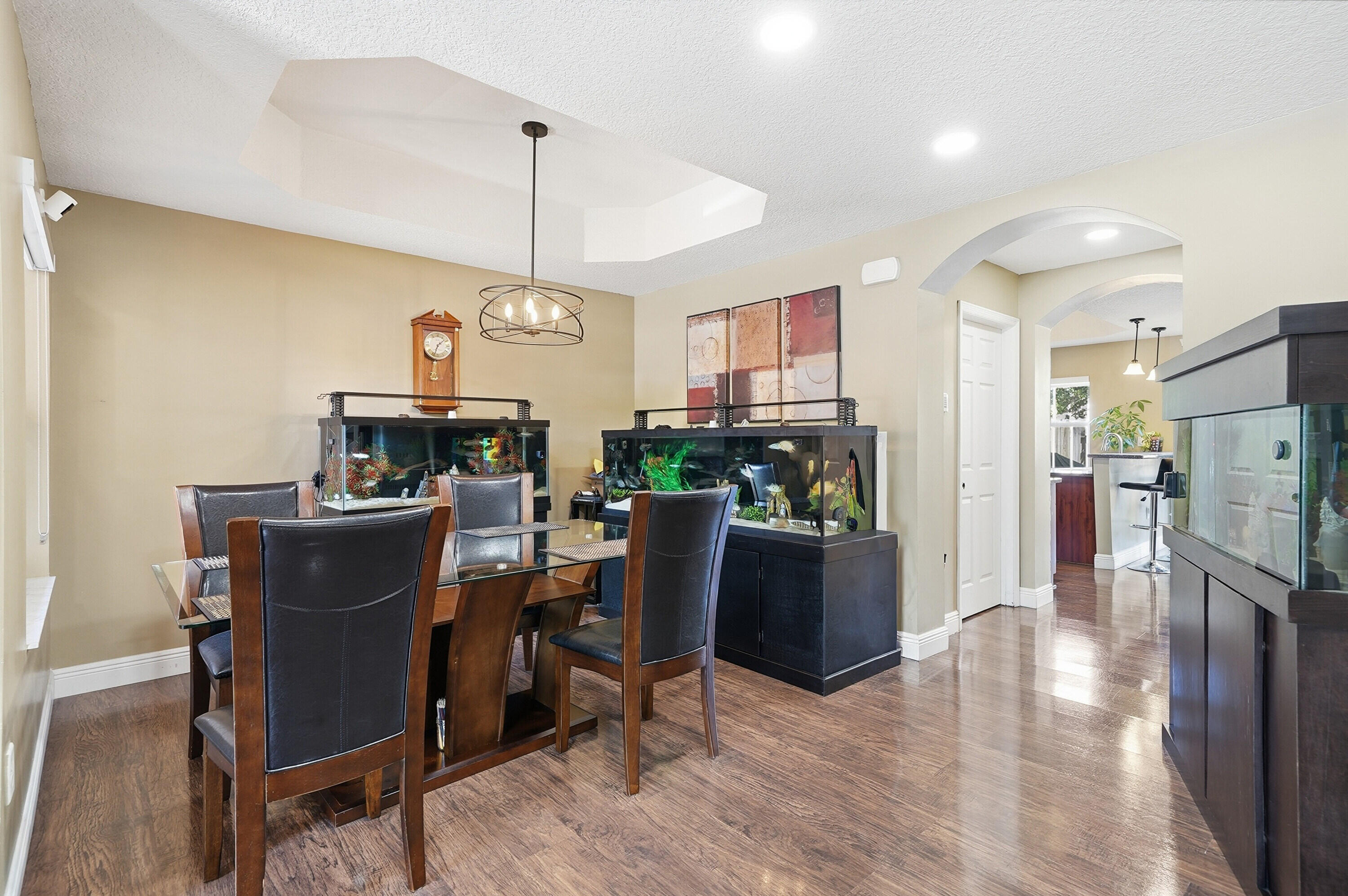 5825 Siena Lane Hollywood, FL 33021 - Photo 10 of 26 a dining room with furniture and wooden floor