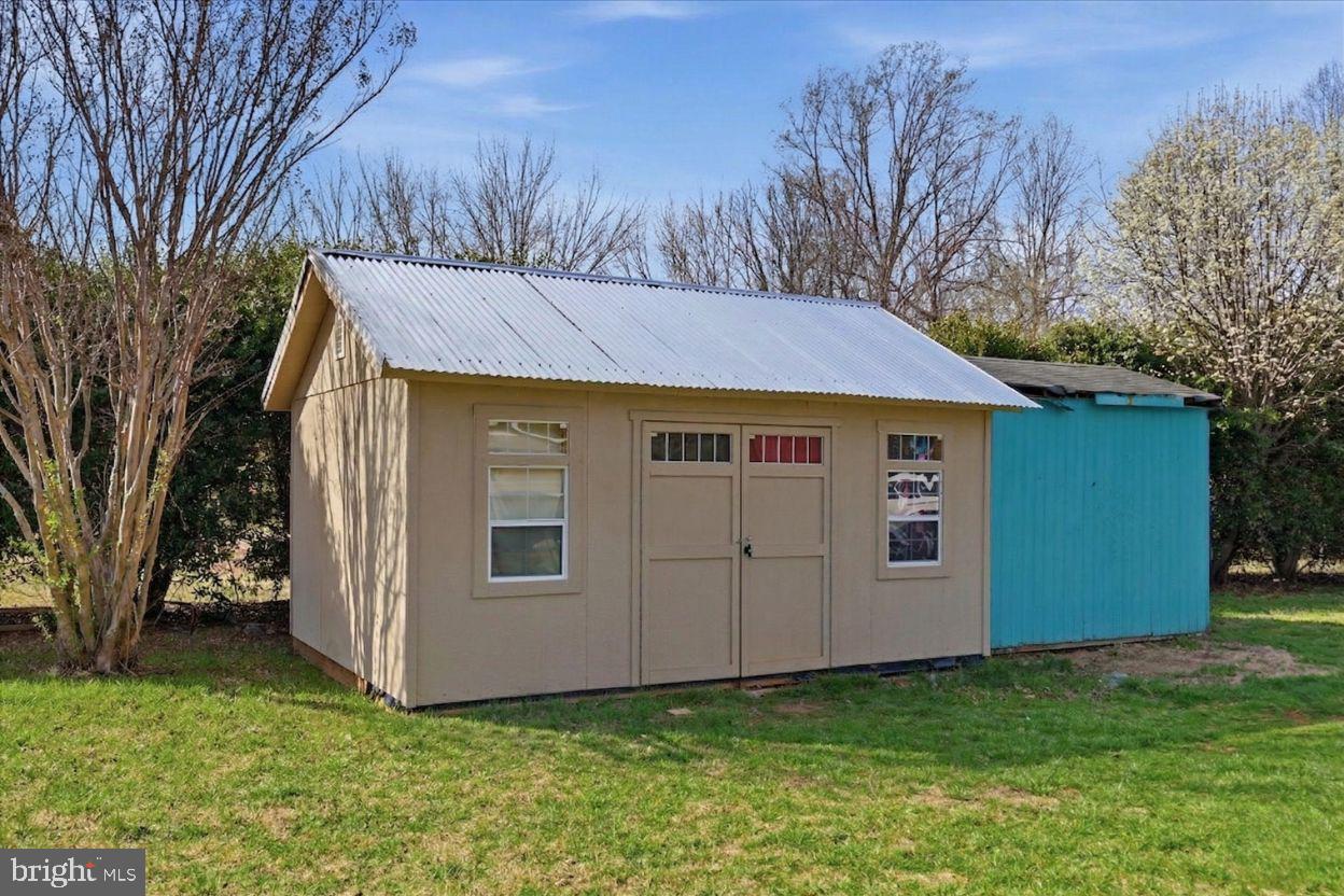 8513 Pamunkey Road Spotsylvania, VA 22551 - Photo 14 of 15 a view of a backyard with a garden