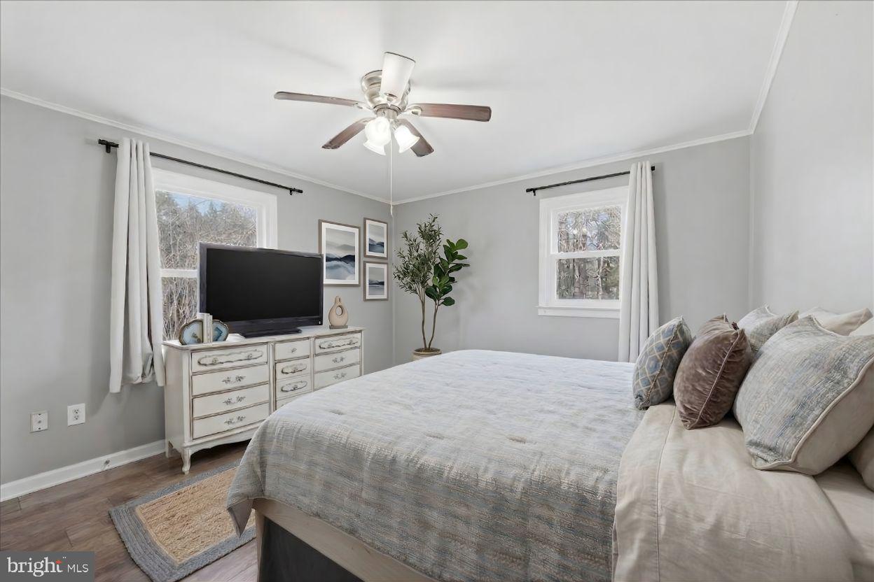 8513 Pamunkey Road Spotsylvania, VA 22551 - Photo 5 of 15 a bedroom with a bed and a flat screen tv