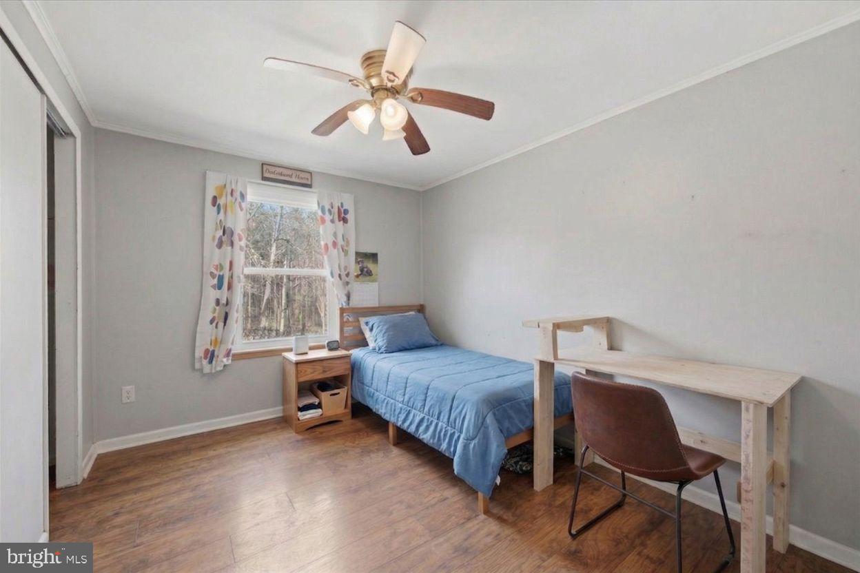 8513 Pamunkey Road Spotsylvania, VA 22551 - Photo 8 of 15 a bedroom with a bed and a window