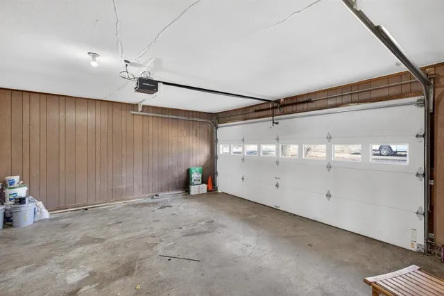 a view of an empty room with a fireplace