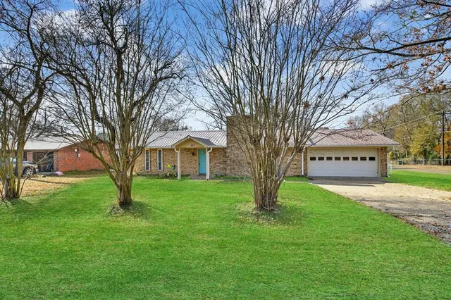 a view of house with yard