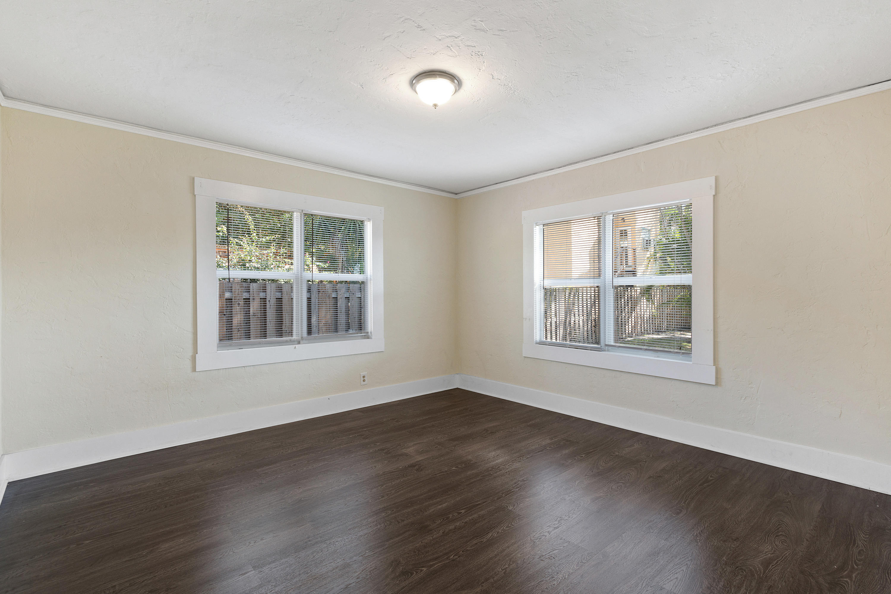 534 Hampton Road West Palm Beach, FL 33405 - Photo 15 of 29 a view of an empty room with wooden floor and a window