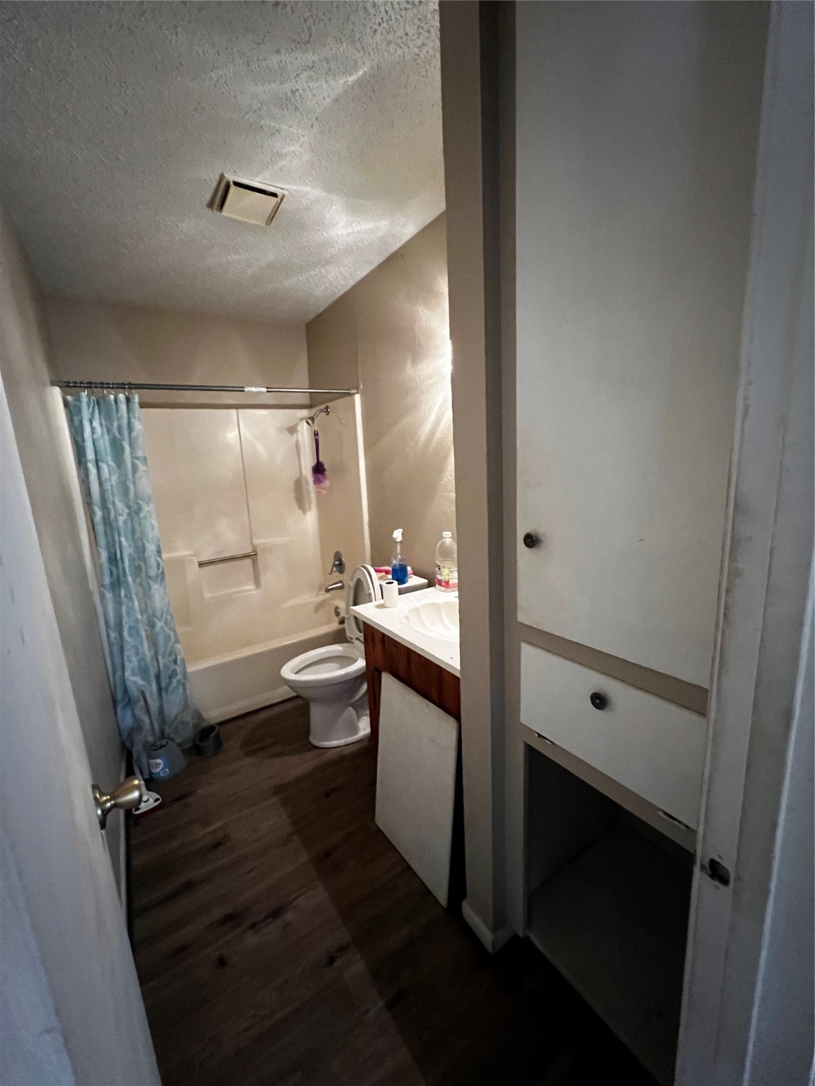 129 John Street Centerville, TX 75833 - Photo 13 of 15 a bathroom with a sink a toilet a mirror and shower