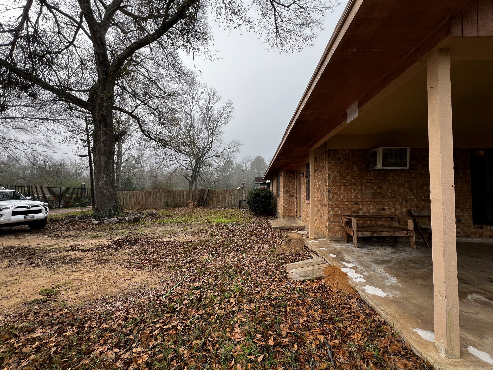 129 John Street Centerville, TX 75833 - Photo 3 of 15 a view of a yard with car parked