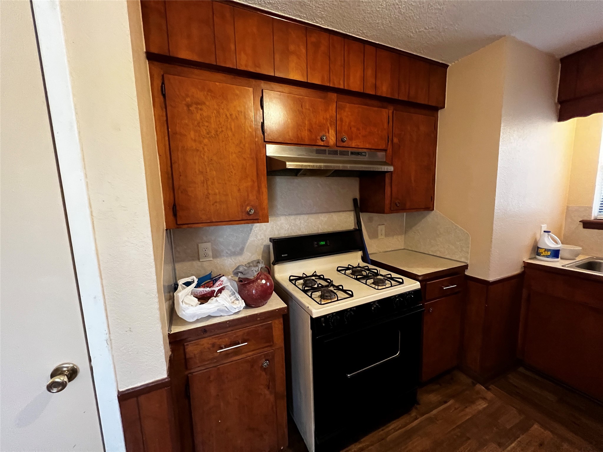 129 John Street Centerville, TX 75833 - Photo 7 of 15 a kitchen with a stove and a refrigerator