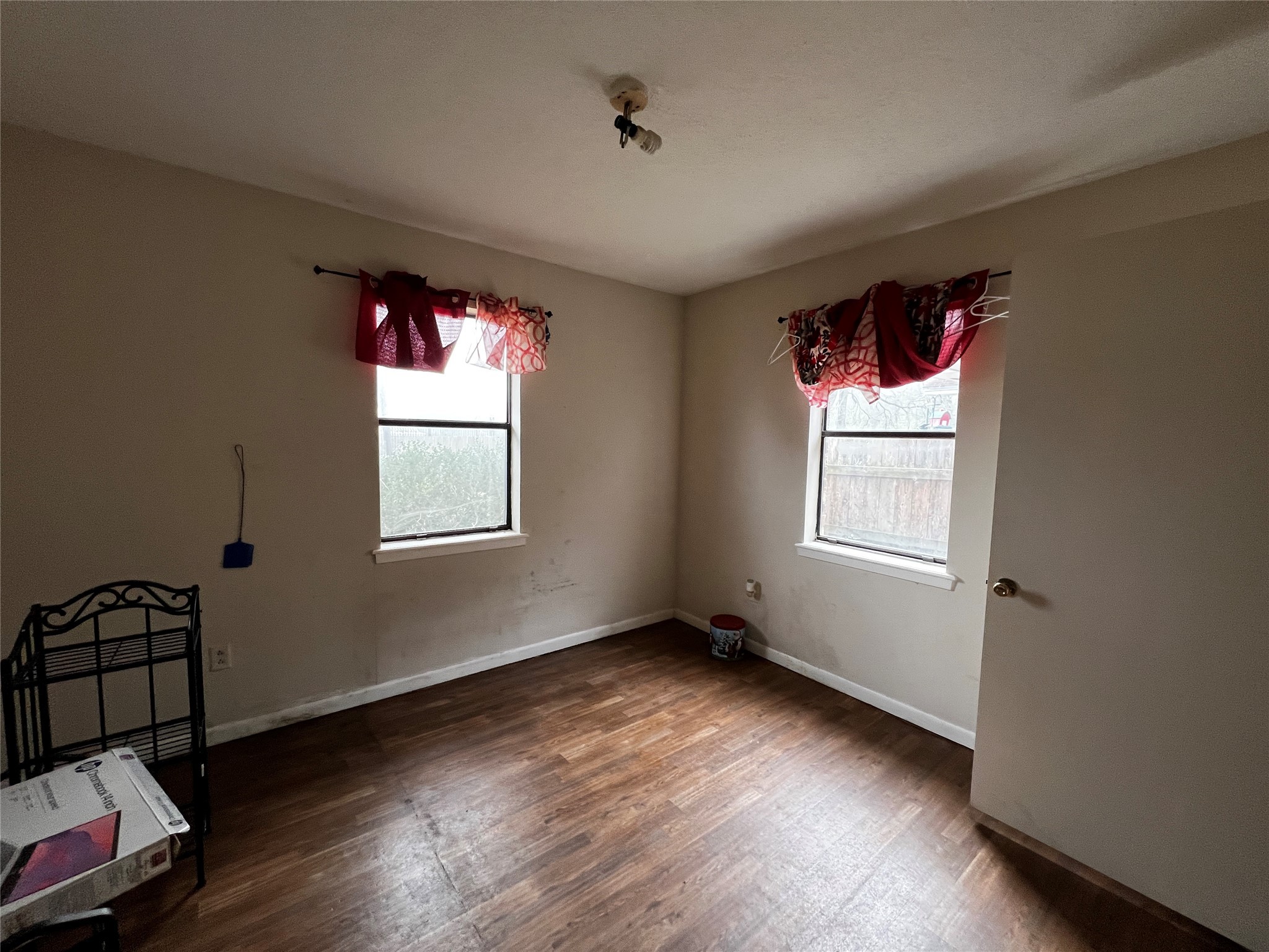 129 John Street Centerville, TX 75833 - Photo 9 of 15 wooden floor in an empty room with a window