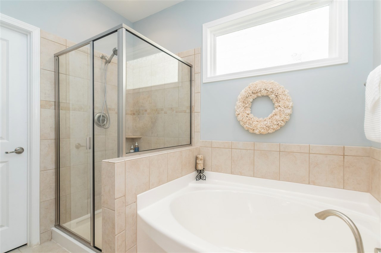 1407 Rodessa Run Raleigh, NC 27607 - Photo 15 of 30 Walk in Tiled Shower and Garden Tub