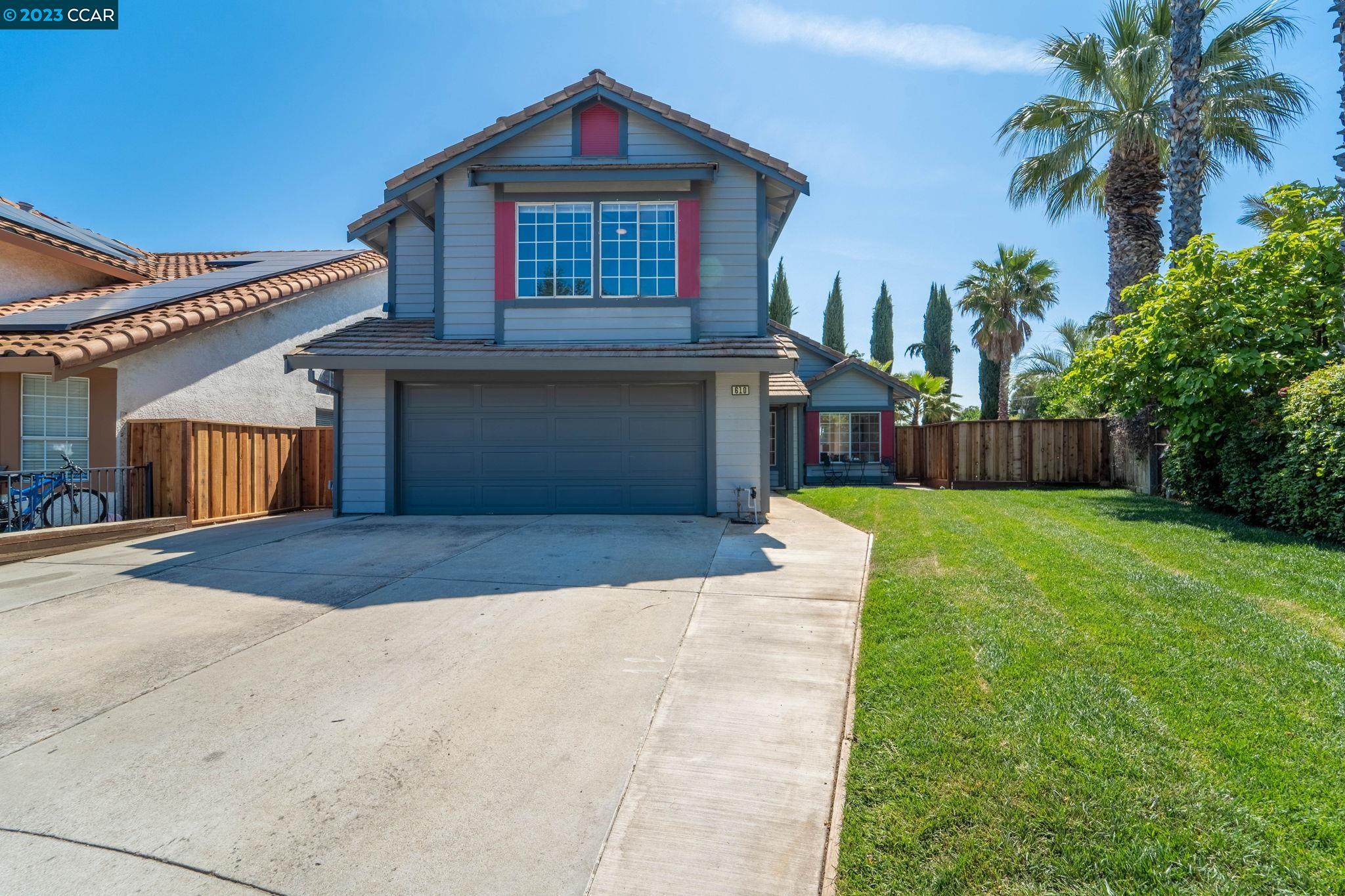 610 Altamont Drive Tracy, CA 95376 - Photo 1 of 1 a front view of a house with garden