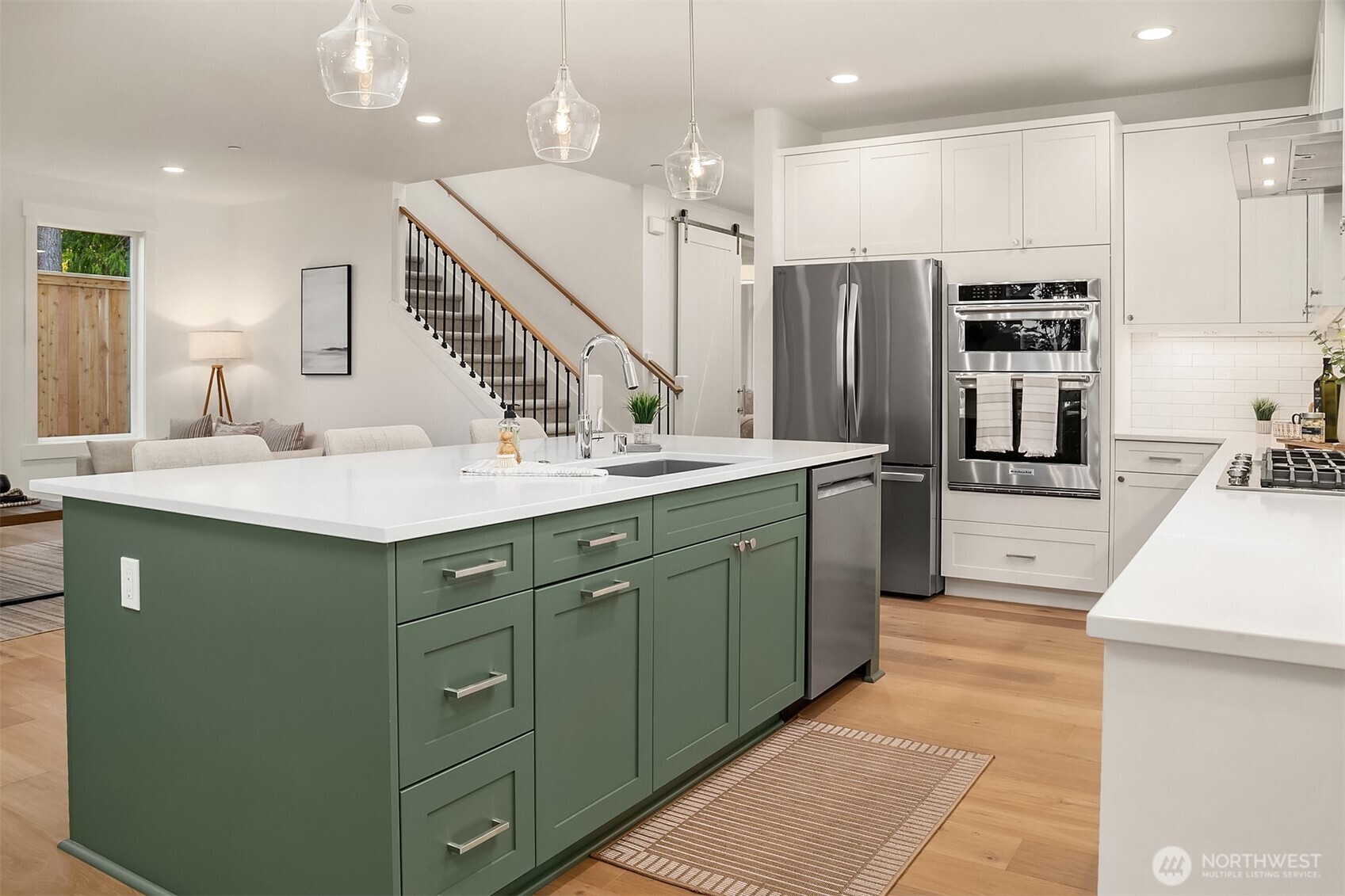22212 98th Avenue West Edmonds, WA 98020 - Photo 11 of 39 a kitchen with kitchen island a sink stainless steel appliances and cabinets
