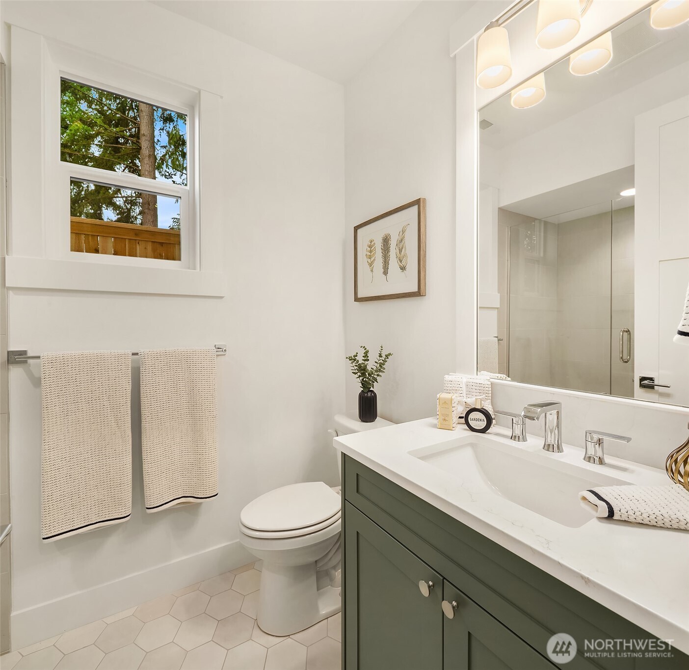22212 98th Avenue West Edmonds, WA 98020 - Photo 22 of 39 a bathroom with a toilet a sink and mirror