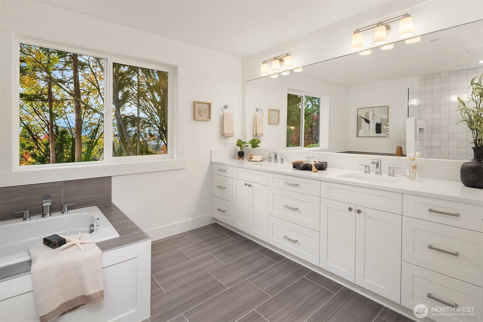 22212 98th Avenue West Edmonds, WA 98020 - Photo 28 of 39 a spacious bathroom with double vanity sink a mirror a window and vanity