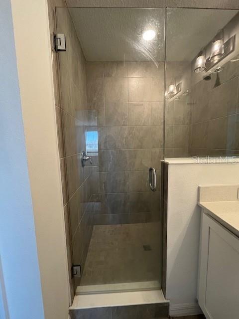 921 Conch Road Davenport, FL 33896 - Photo 12 of 21 a bathroom with a shower
