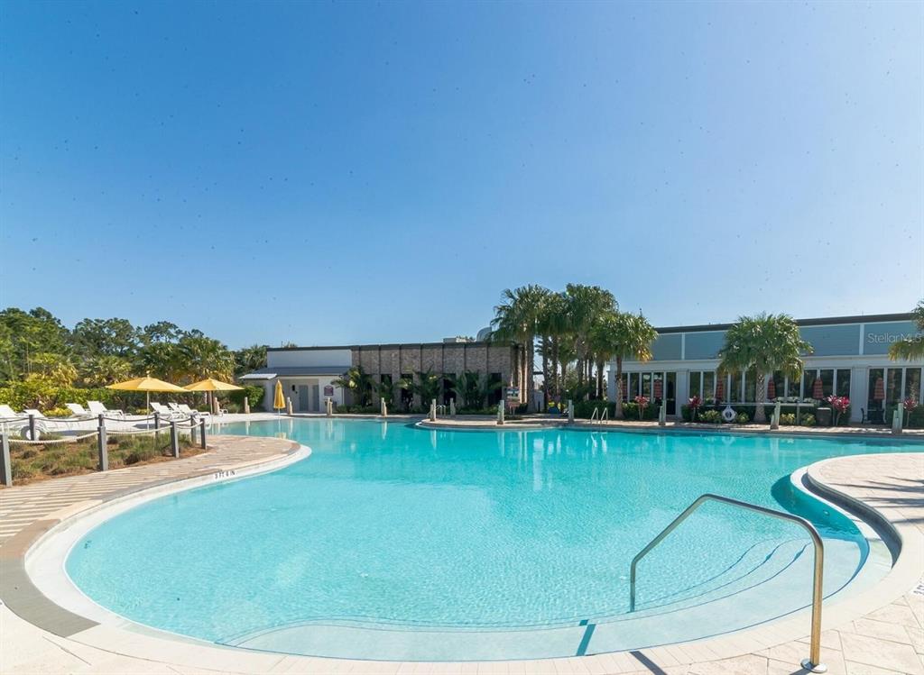 921 Conch Road Davenport, FL 33896 - Photo 15 of 21 a view of a swimming pool with a garden