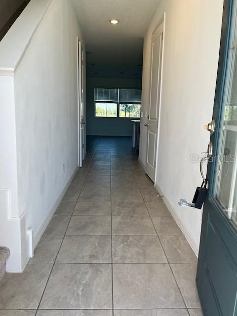 921 Conch Road Davenport, FL 33896 - Photo 3 of 21 a view of hallway with a window and fire place