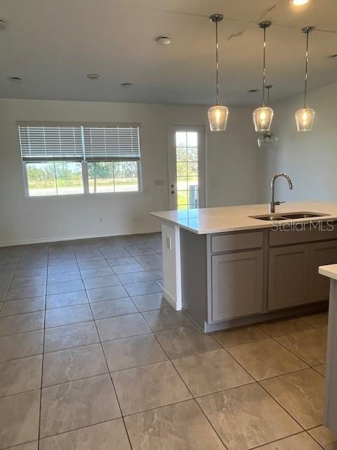921 Conch Road Davenport, FL 33896 - Photo 7 of 21 a large kitchen with lots of counter space and a sink