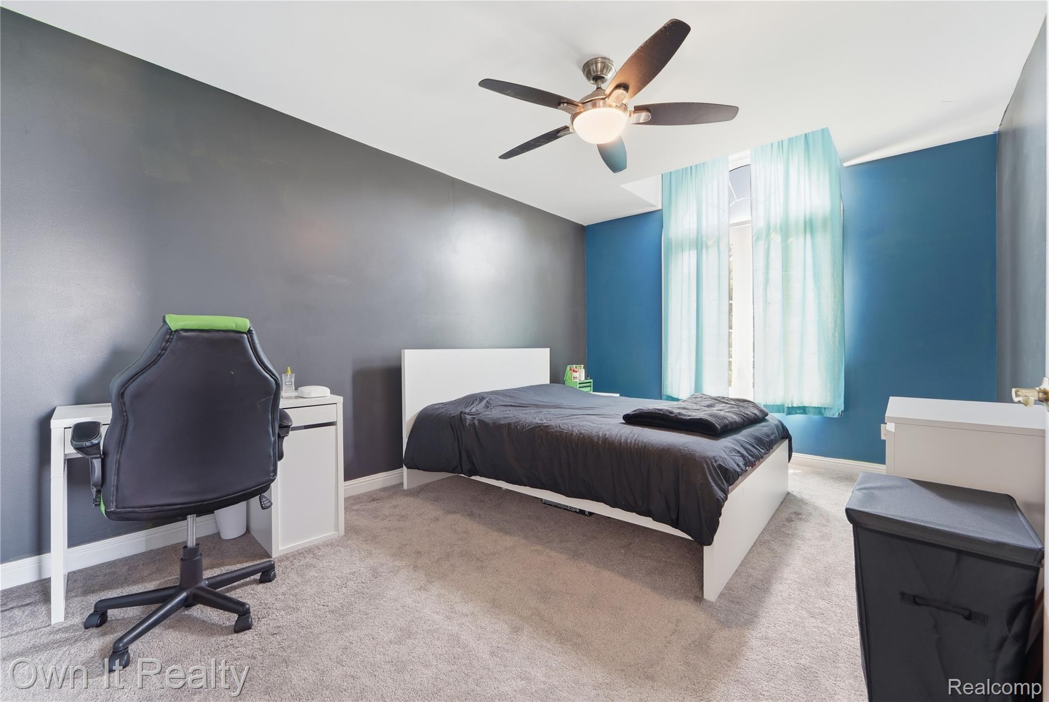 48280 Gladstone Road Canton, MI 48188 - Photo 43 of 59 Carpeted room featuring a ceiling fan with light fixture, a window with sheer curtains, and contrasting wall colors