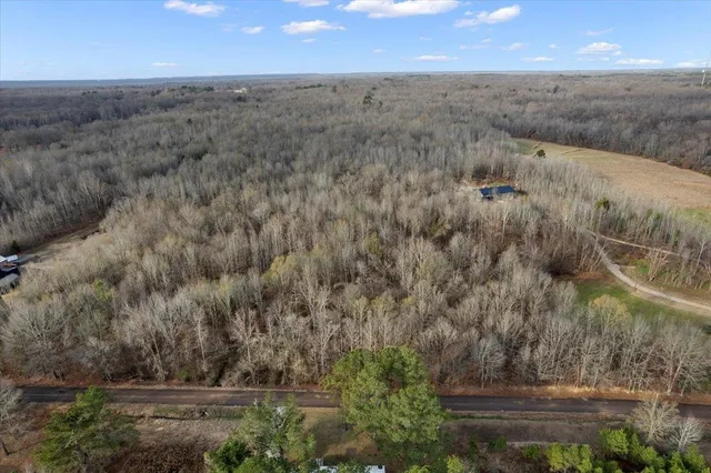 an aerial view of house with yard