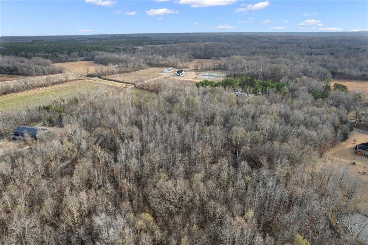 0 Coney Road Rossville, TN 38066 - Photo 6 of 11 Aerial view of property and surrounding area with a heavily wooded area