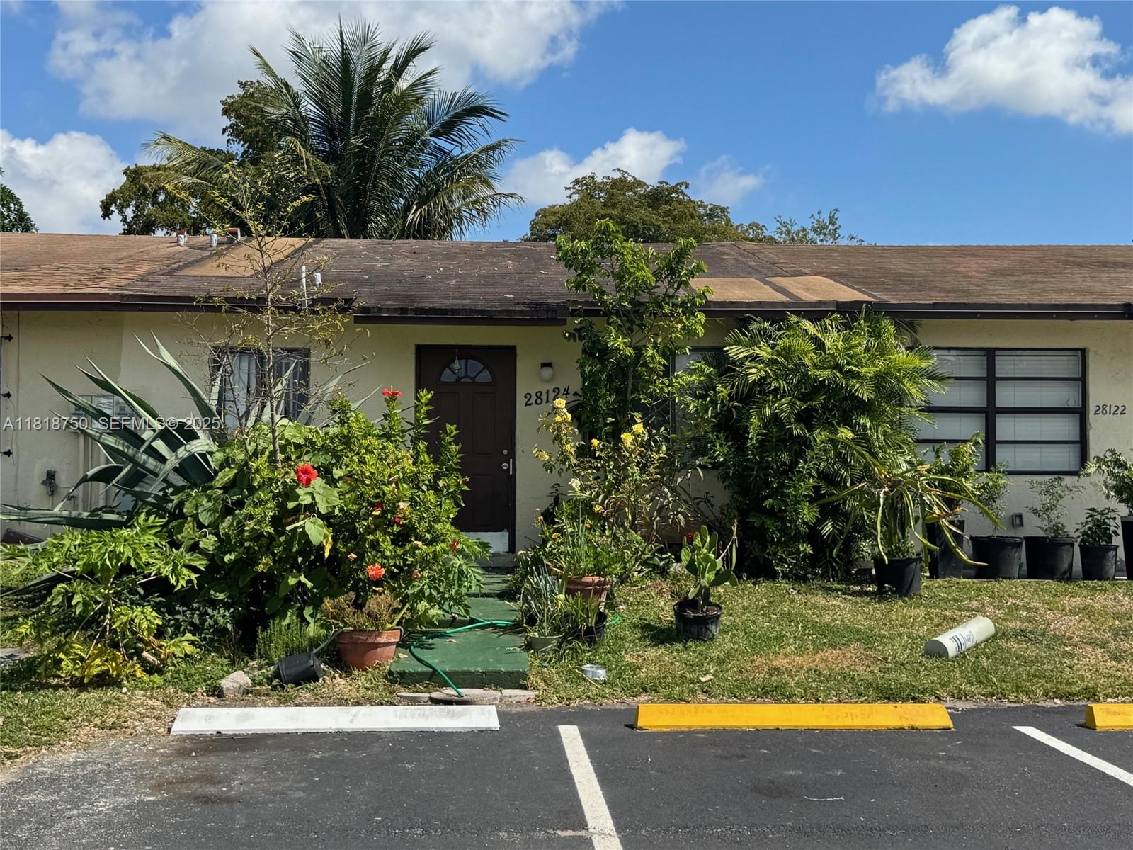 14266 Southwest 283rd Street Homestead, FL 33033 - Photo 4 of 13 a view of a house with swimming pool and sitting area