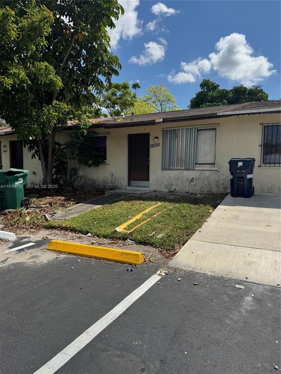 14266 Southwest 283rd Street Homestead, FL 33033 - Photo 7 of 13 a view of a house with swimming pool and a yard
