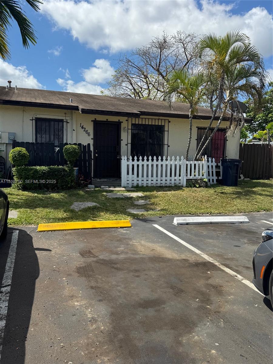 14266 Southwest 283rd Street Homestead, FL 33033 - Photo 9 of 13 a view of a house with swimming pool and a yard