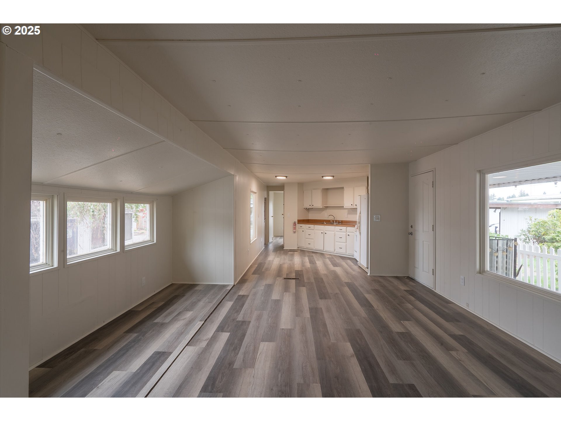 5355 River Road North Keizer, OR 97303 - Photo 8 of 20 a view of empty room with wooden floor and fan