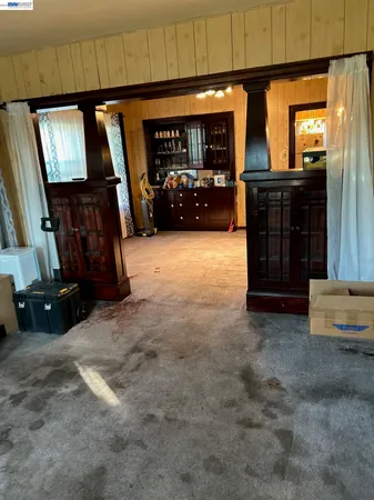 a view of a livingroom with furniture and window