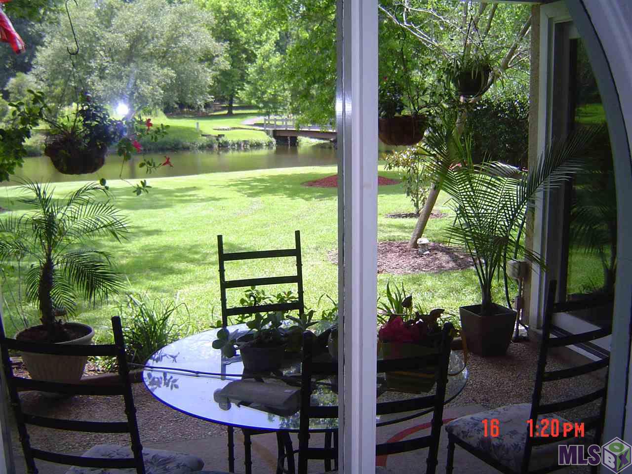 1615 Applewood Road Baton Rouge, LA 70808 - Photo 11 of 26 Covered Porch with Pool & Lake Views