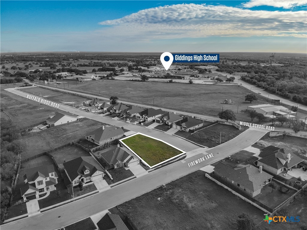 331 Firework Lane Giddings, TX 78942 - Photo 1 of 5 an aerial view of a residential building and an ocean view