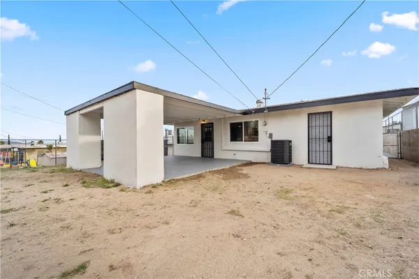 a big room with closet and a kitchen