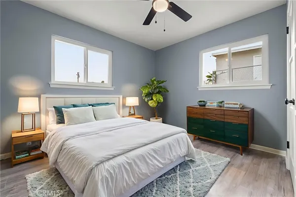 a dining room with furniture and a large window