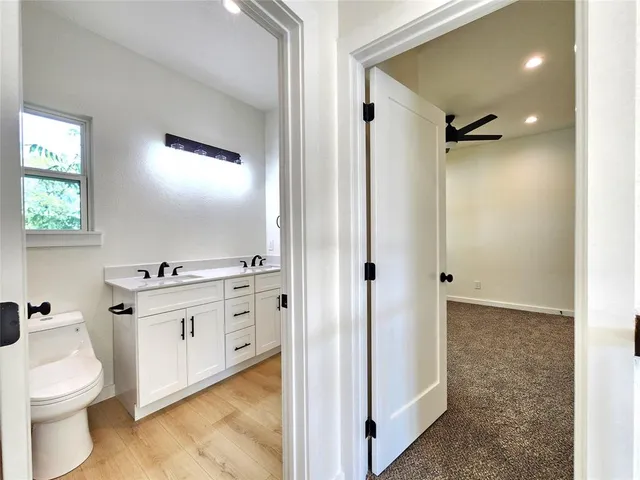 a kitchen with a stove a sink and a refrigerator