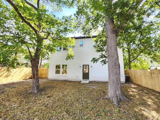 a house with a tree in front of it