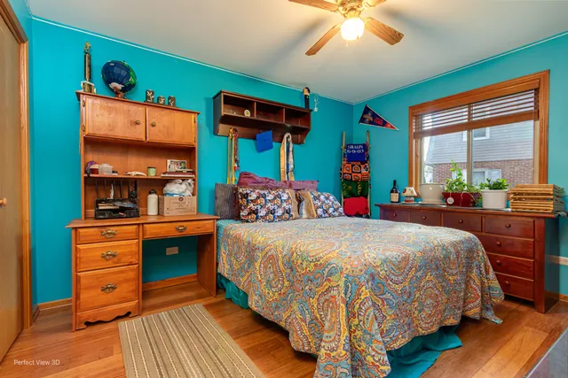 a bedroom with a bed and a dresser