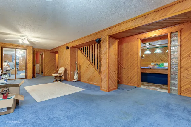 a view of an empty room and a balcony