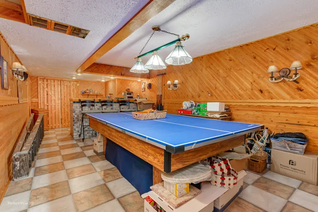 a room with lots of appliances and cabinets