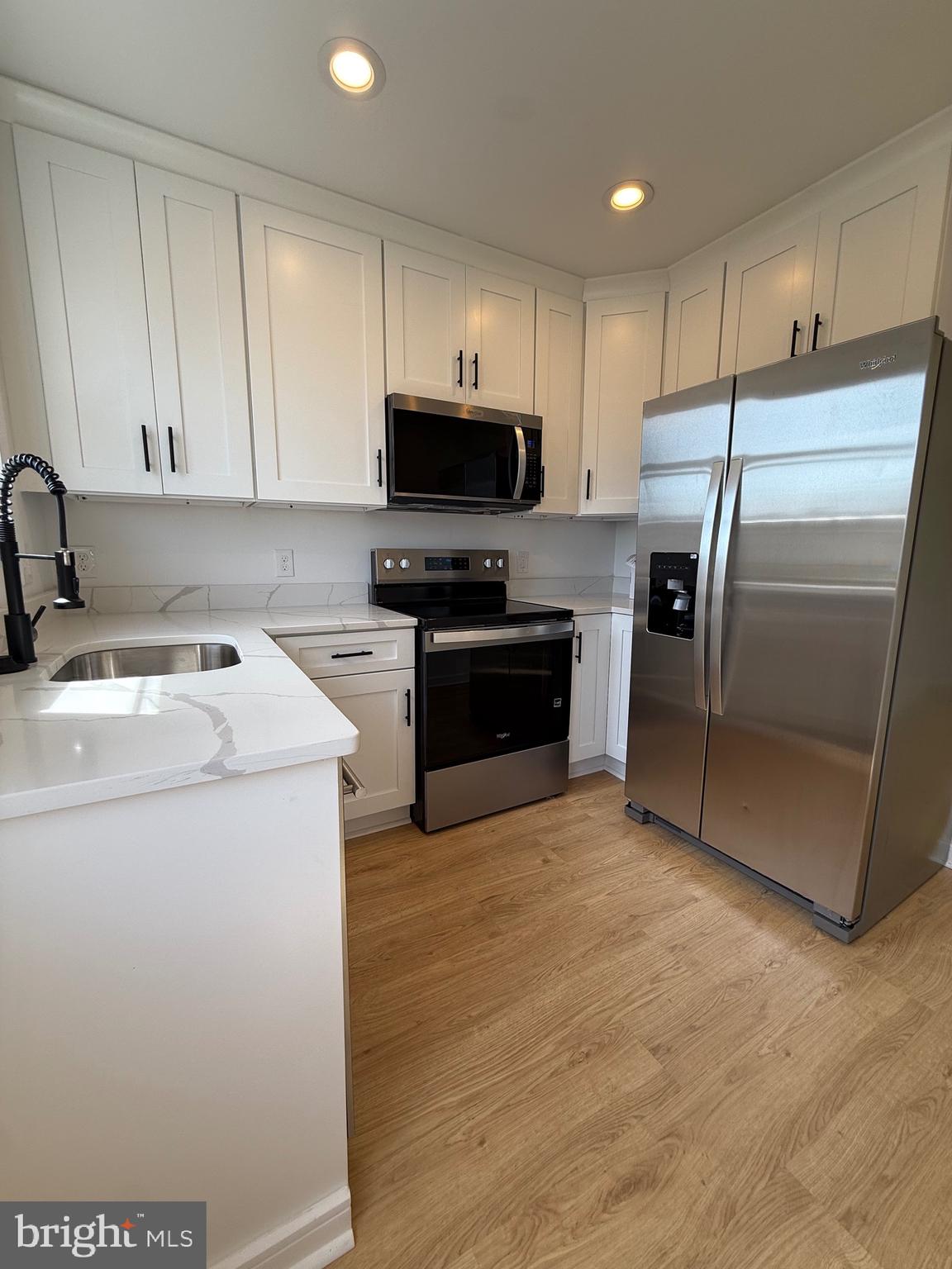 2125 Oakland Road Middle River, MD 21220 - Photo 2 of 15 a kitchen with a sink a stove and refrigerator